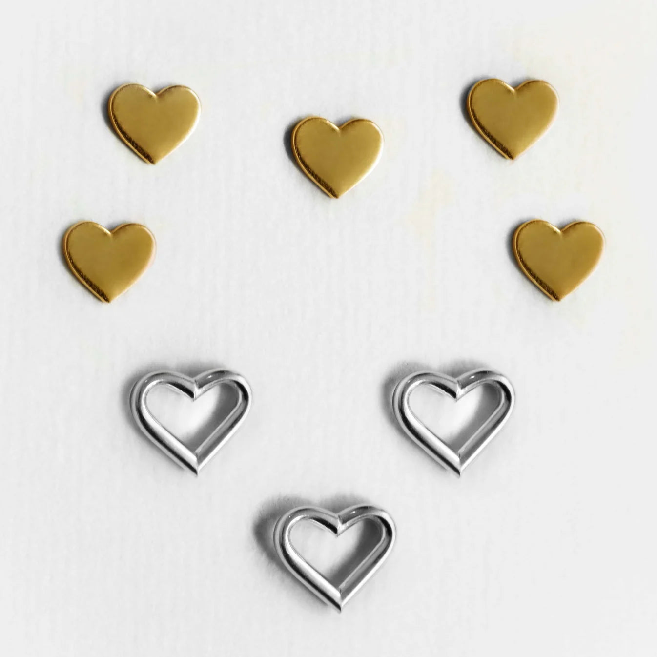 Par de aros  botón corazón en Plata de Sincerely
