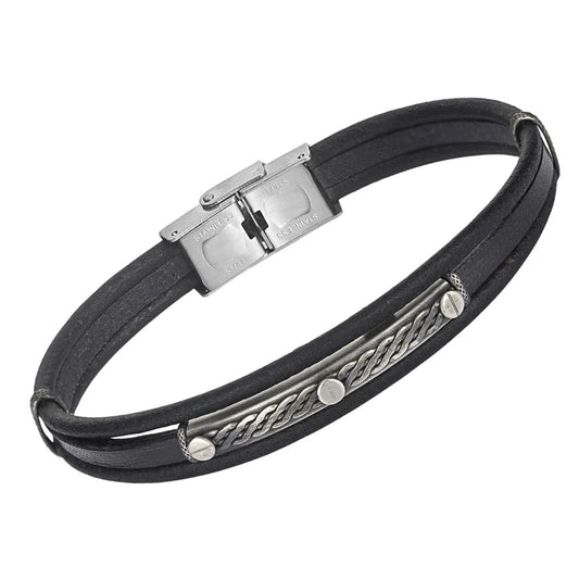 Pulsera de acero y cuero negro con placa bruñida y productos semiacabados.